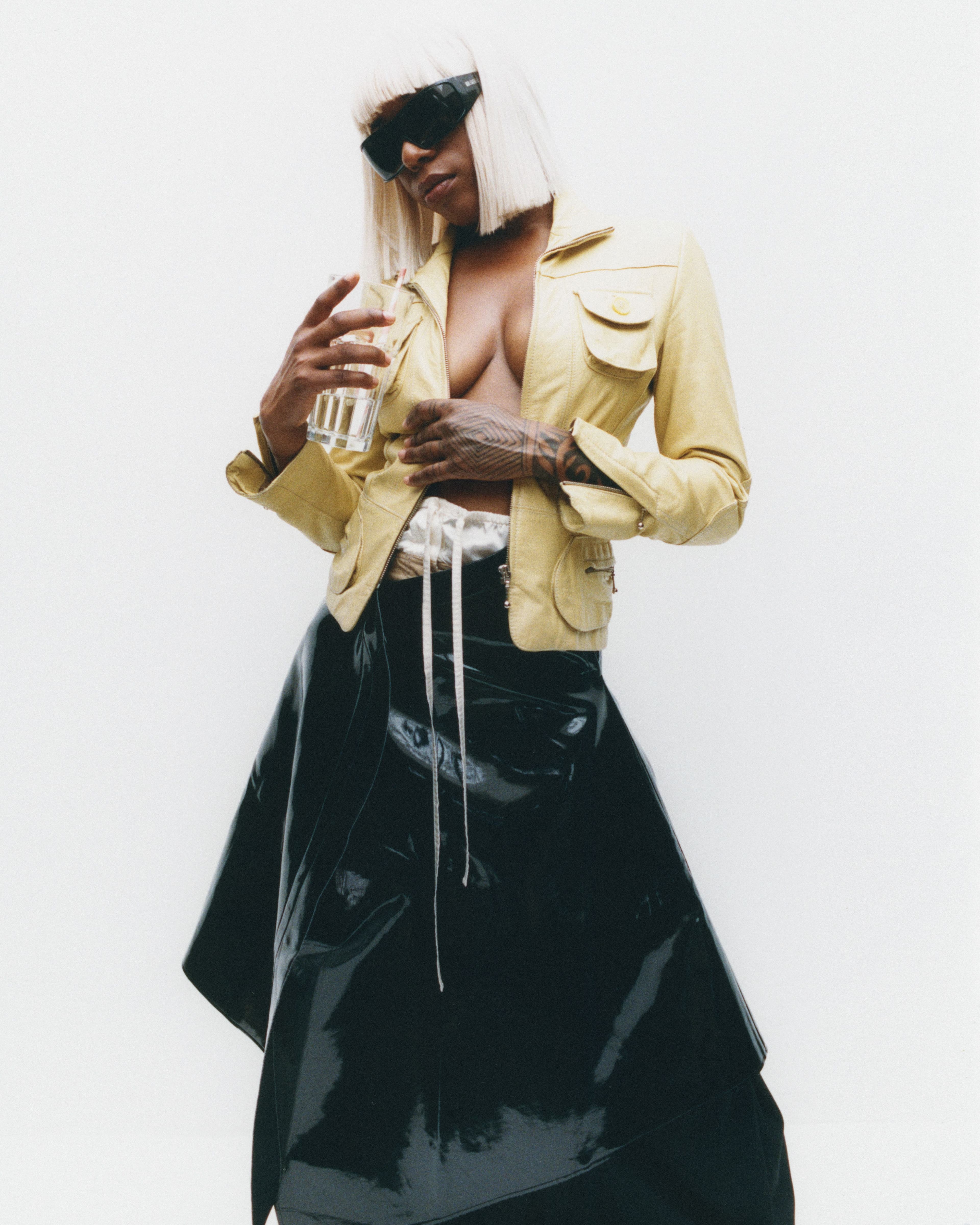 Jacket, stylist’s own. Skirt by Junya Watanabe. Pants, worn underneath, by Acne Studios.