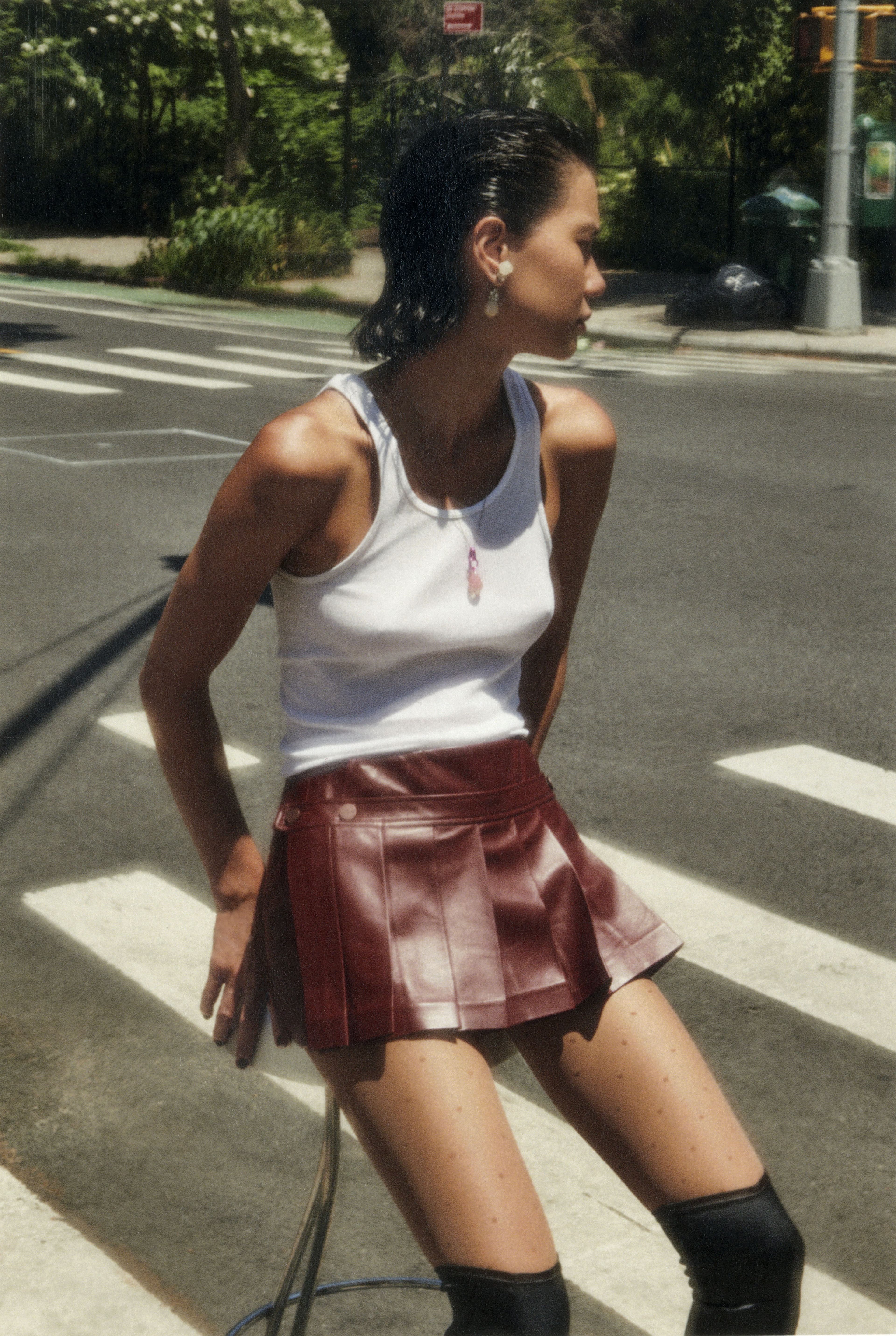 Vintage tank top. Skirt by ASHLYN. Tights by Wolford. Vintage boots by Jean Paul Gaultier.