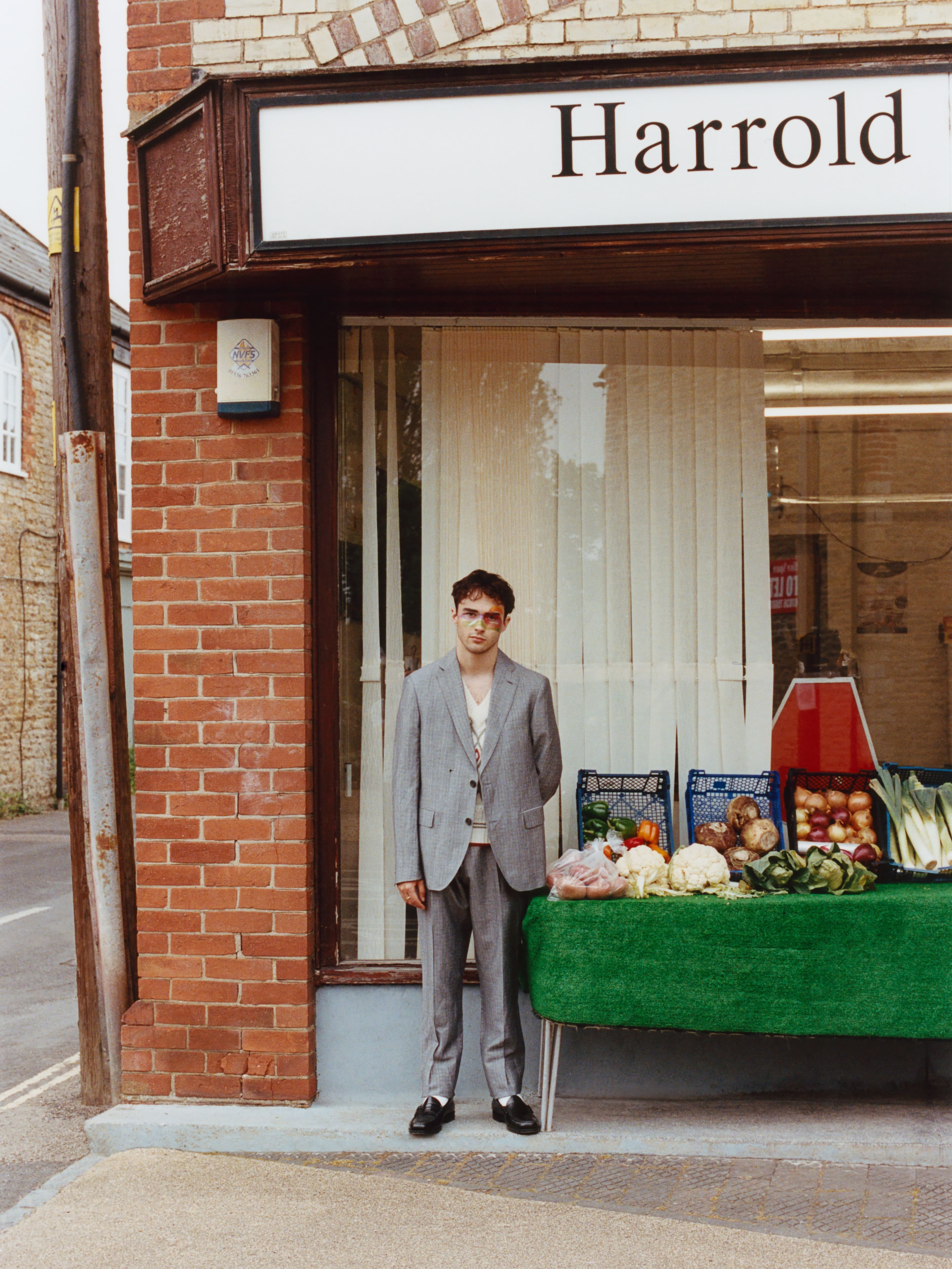 Suit by Tommy Hilfiger. Vest by S.S. Daley.