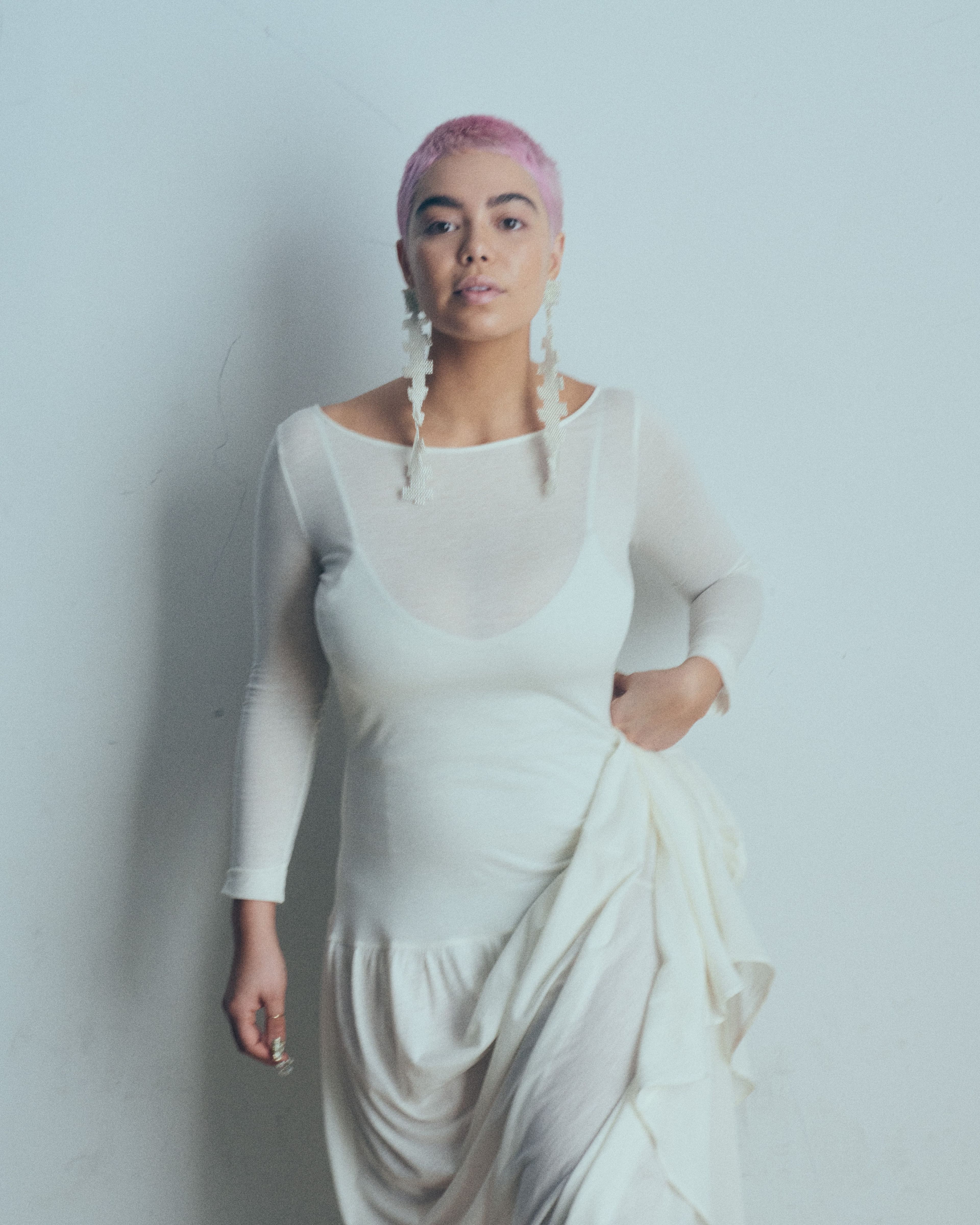 Dress by Bevza. Bodysuit by Haus Label. Earrings by Mozhdeh Matin.