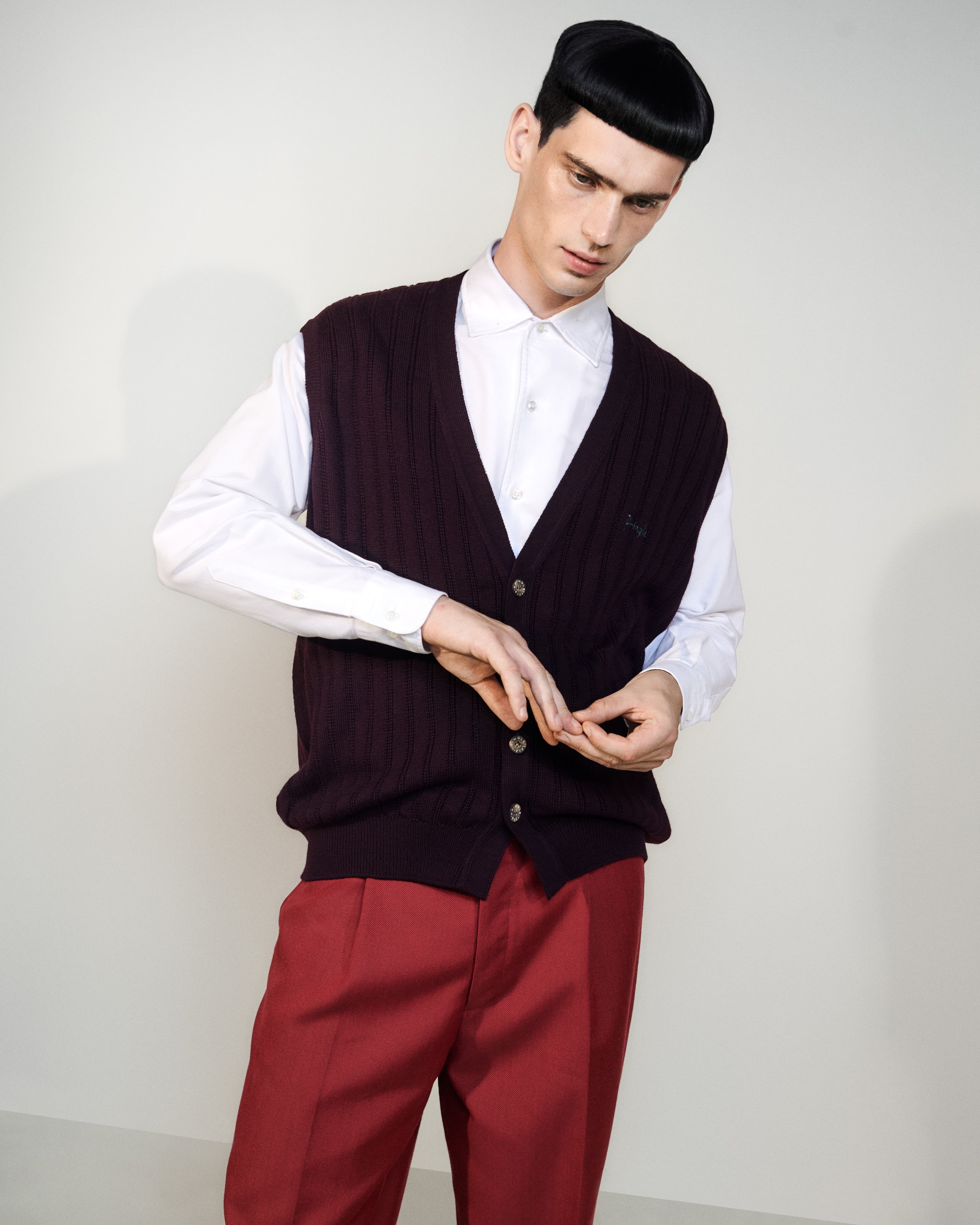 Vintage vest by Pringle, stylist’s own. Shirt by Loro Piana. Pants by Ouer.