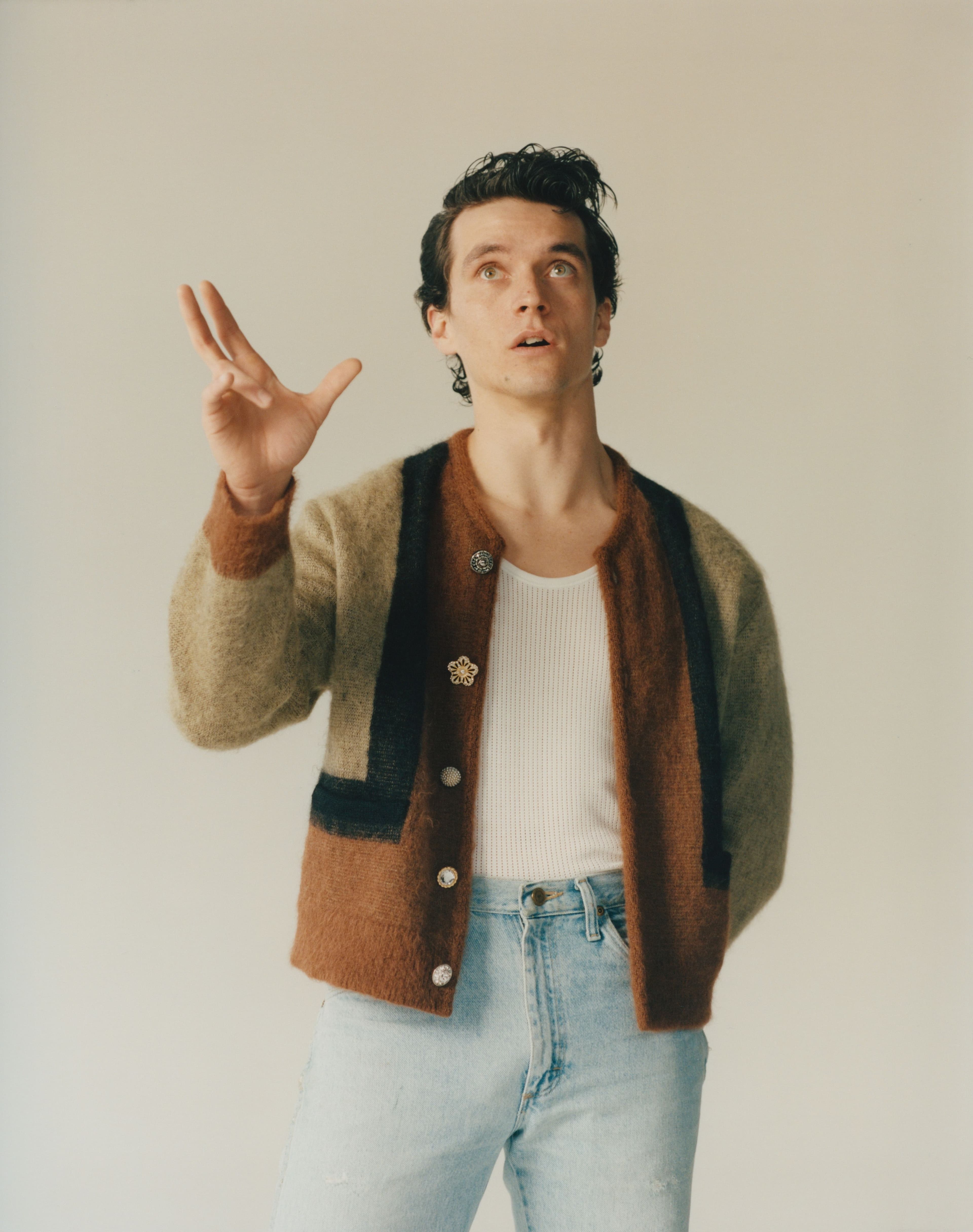 Sweater by Celine by Hedi Slimane. Top and jeans, stylist’s own.