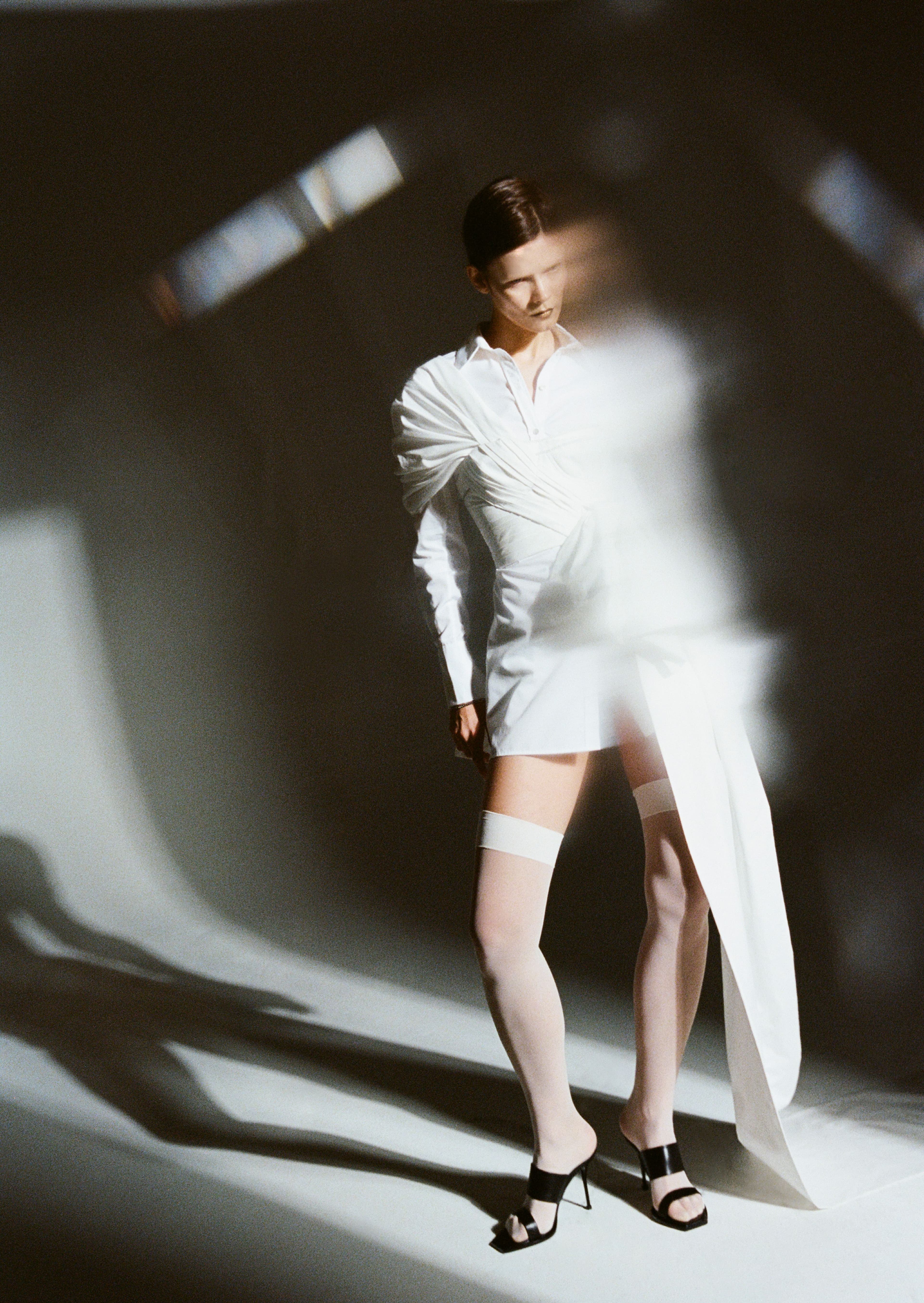 Top and shirt by Erdem. Shorts by Miu Miu. Shoes by Alexander McQueen.