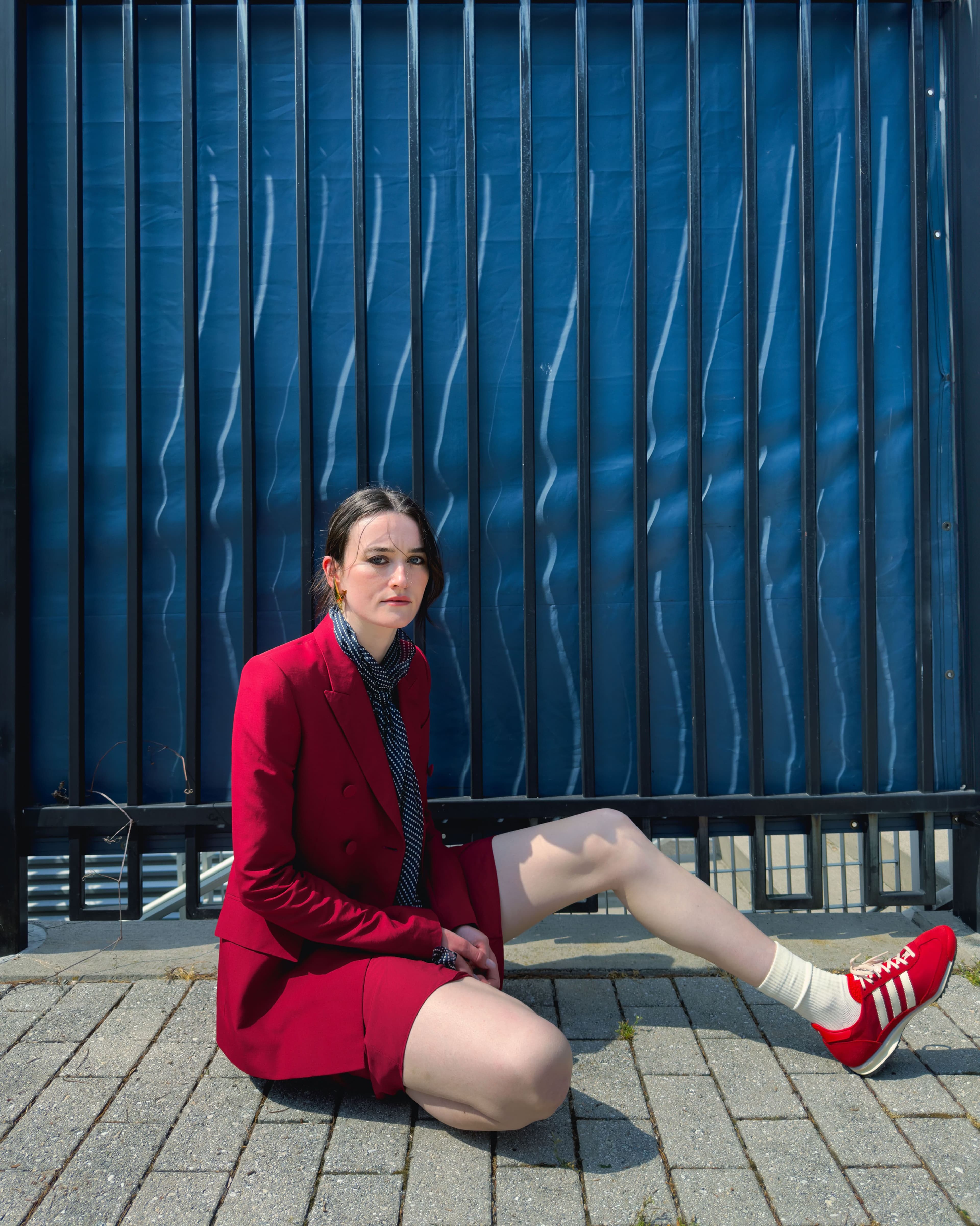 All CLOTHING, SCARF, and EARRINGS by ,Givenchy. ,SOCKS by ,COS,. SHOES by ,Adidas. ,RING by ,Completed Works.