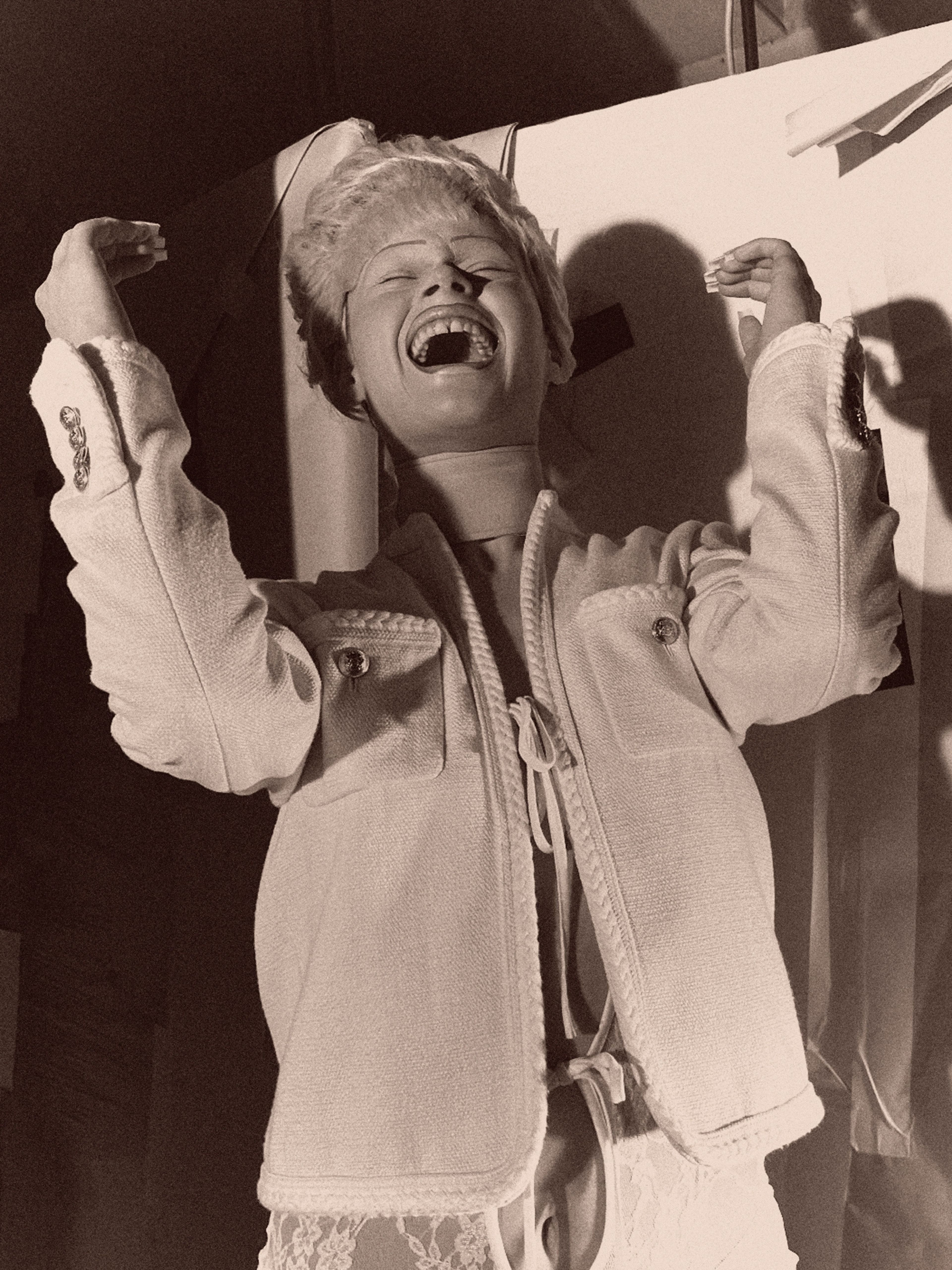 Jacket by Celine by Hedi Slimane. Bodysuit by Nicolas Guichard. Choker by Burberry.