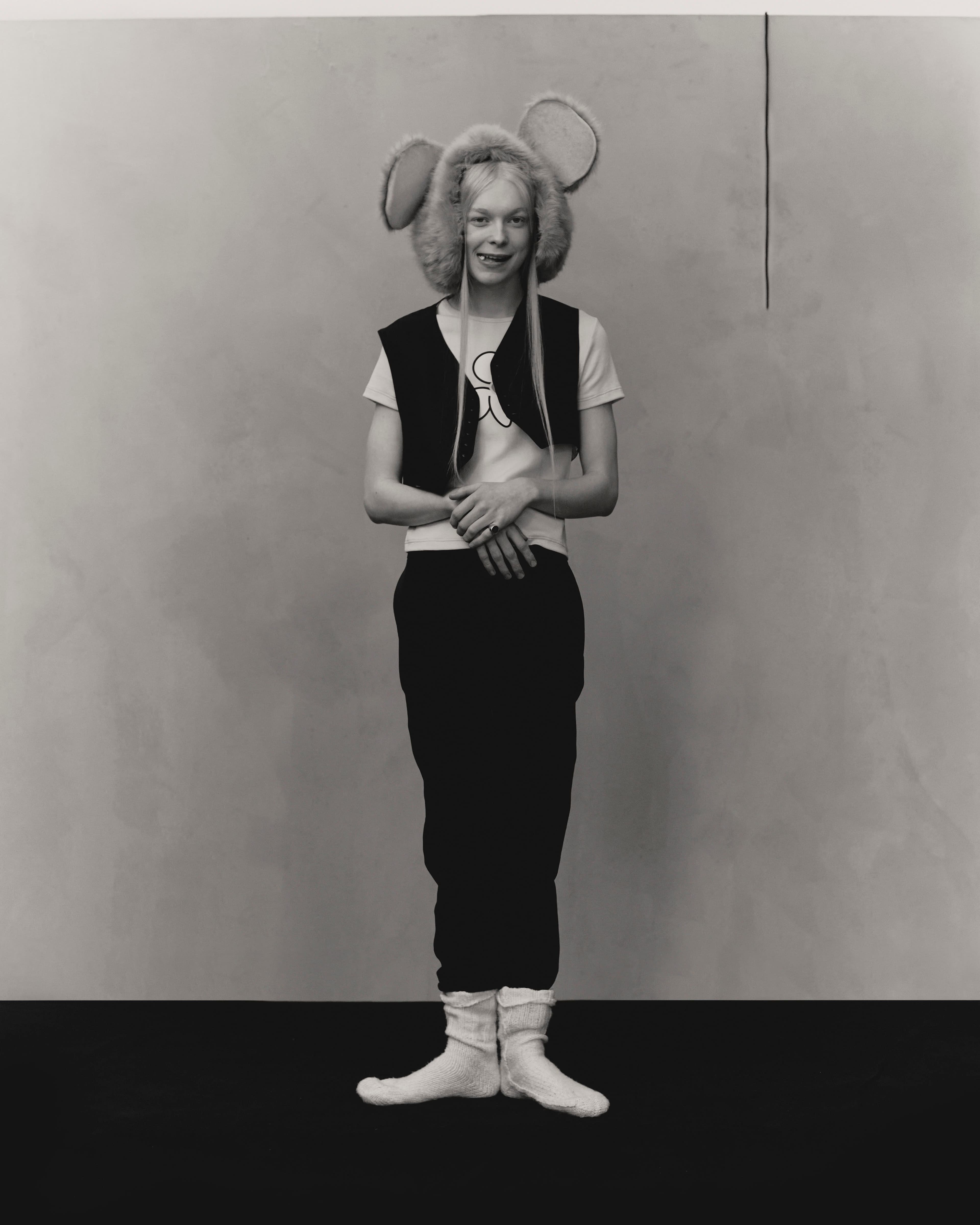 Vintage waistcoat by Jean Paul Gaultier from the 20Age Archive. T-shirt by Lazoschmidl. Pants by Alexander McQueen. Headpiece from the Costume Studio. Socks, stylist’s own.