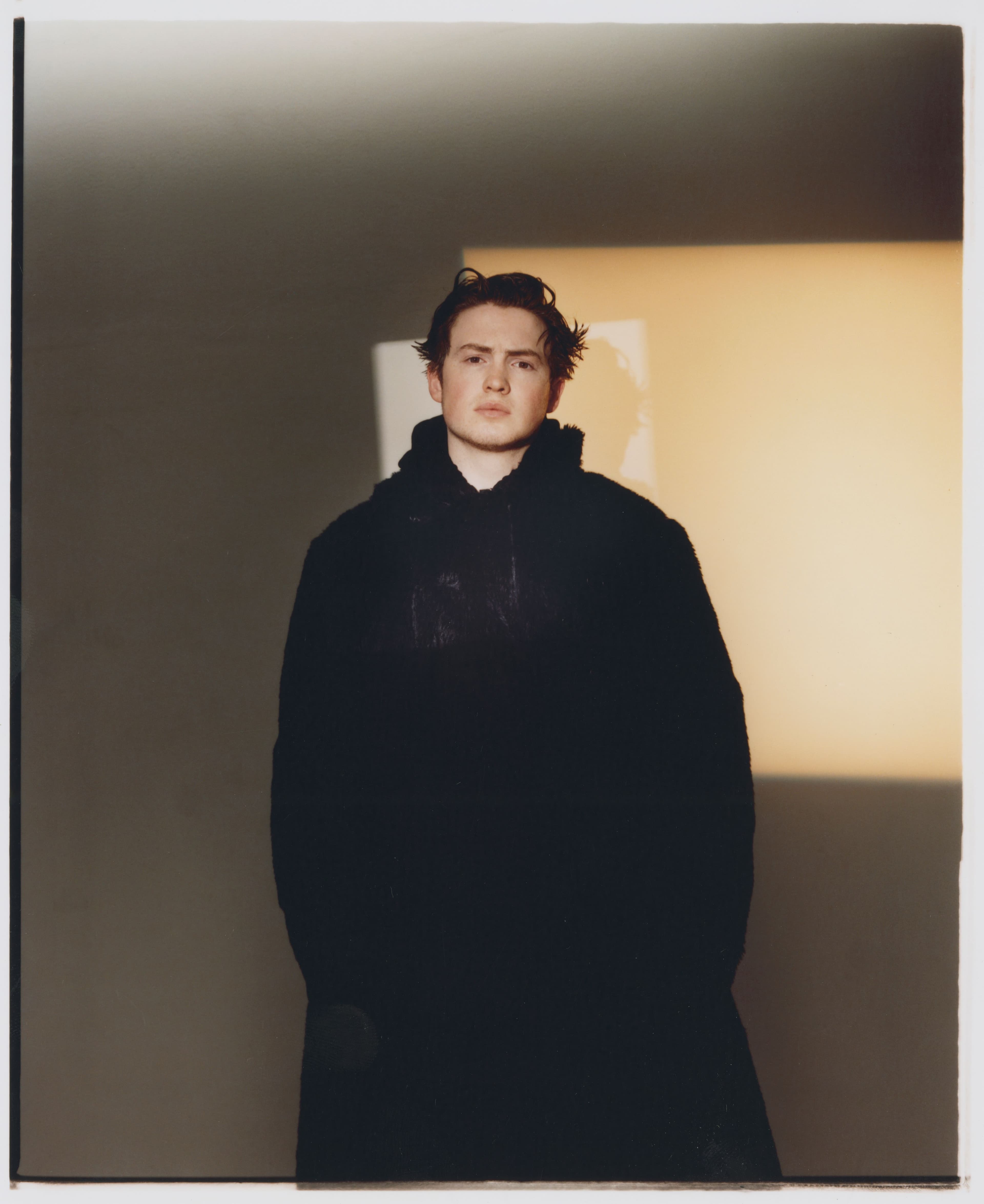 Vintage coat by Yohji Yamamoto from the 20Age Archive. Top and pants by Stussy.