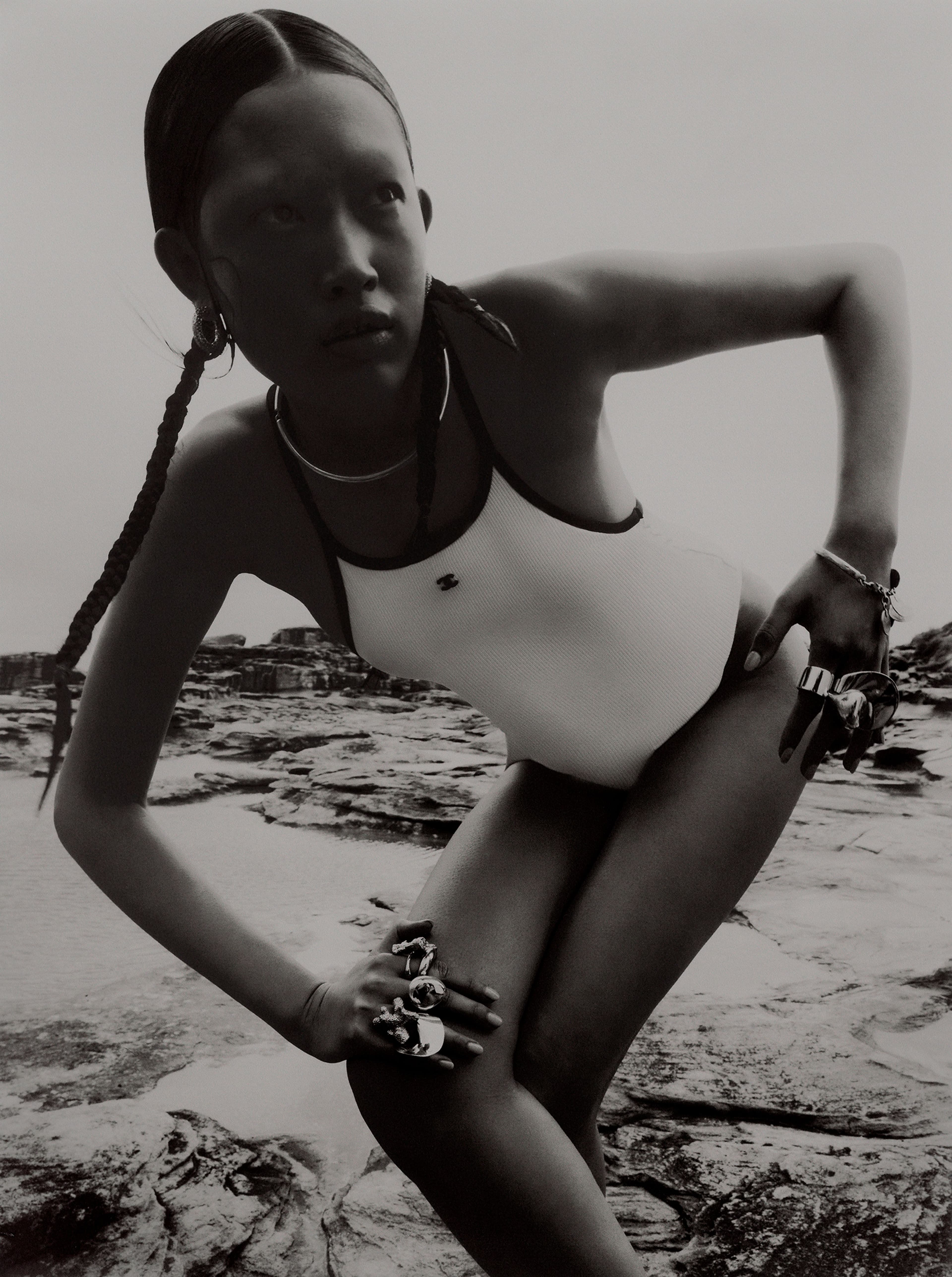 Swimsuit by Chanel. Vintage necklace and bracelet from Uuli’s Unique & Unusual. Earrings by Christopher Esber. All rings by Dinosaur Designs.