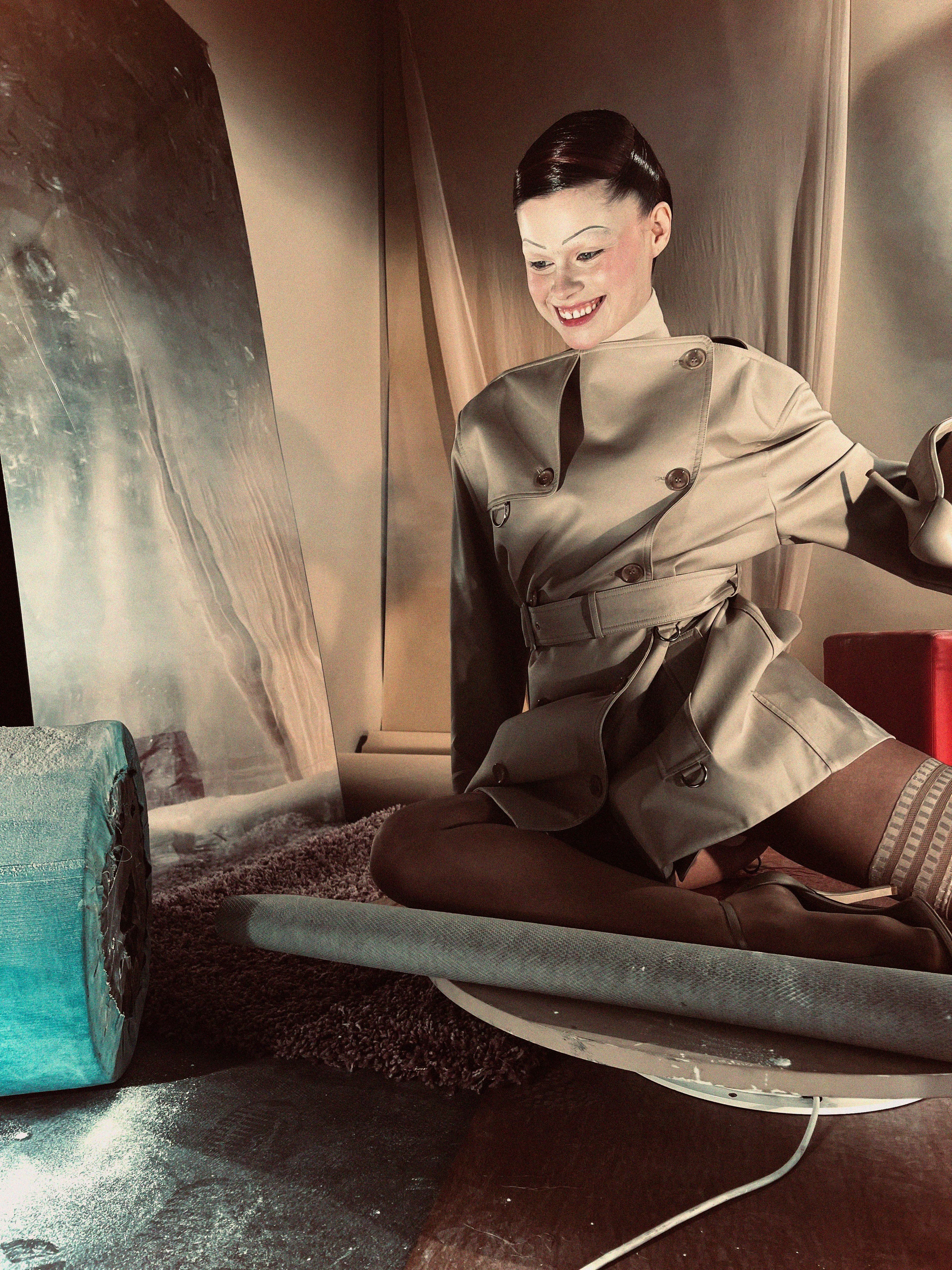 Jacket, choker, and shoes by Burberry. Tights by Falke.