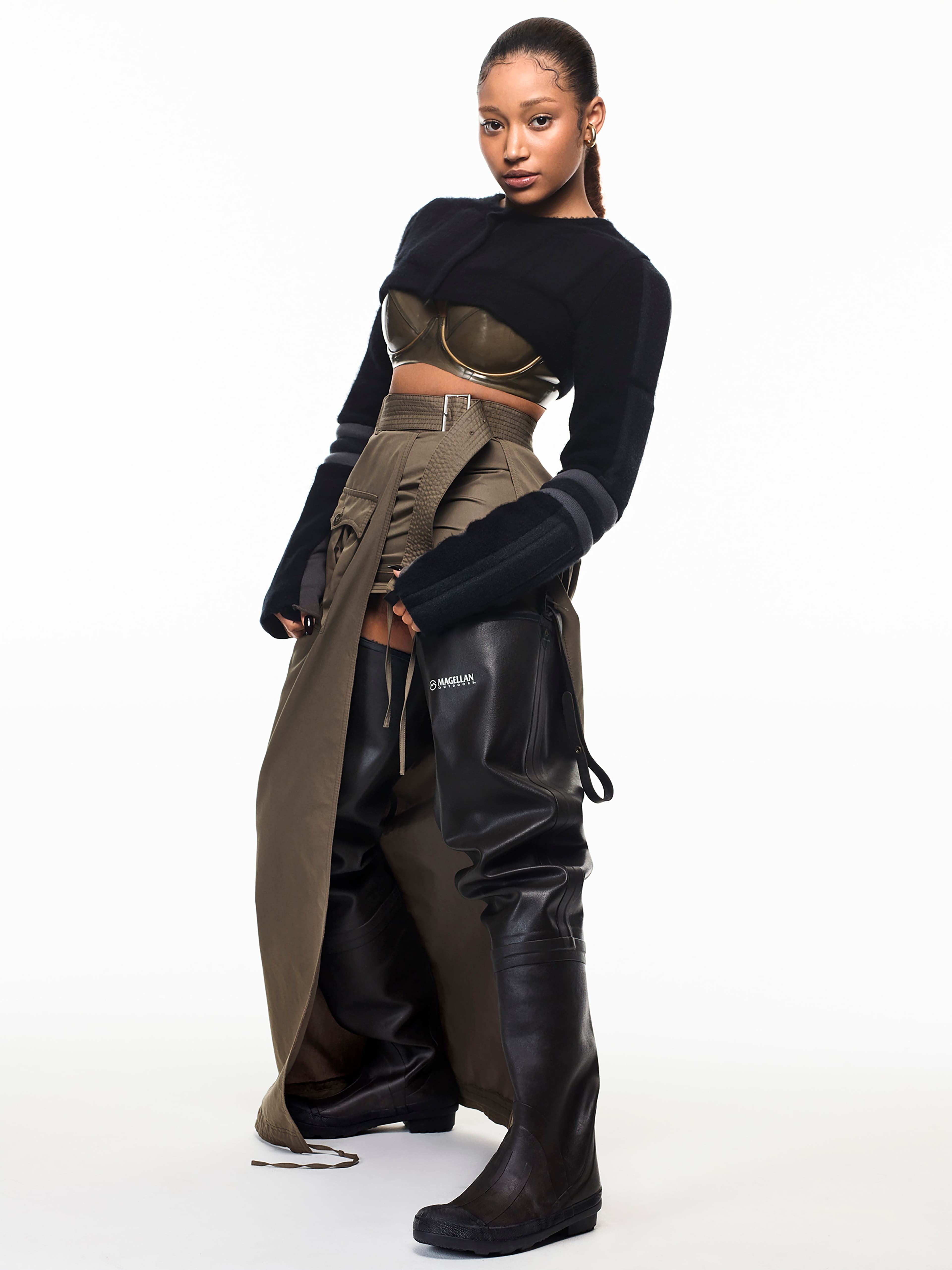 Vintage top by Helmut Lang from the David Casavant Archive. Bra by Atsuko Kudo. Vintage skirt by Jean Paul Gaultier from the Albright Fashion Library. Boots by Magellan. Ear cuff by All Blues.